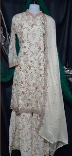 Elevate your elegance with this off white sharara suit