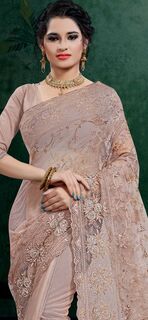 Wrap yourself in the luxurious charm of Beaver Fur Brown Beige  Net saree