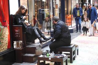 Well heeled shopper taking a hard earned break.  Portland Place, London UK