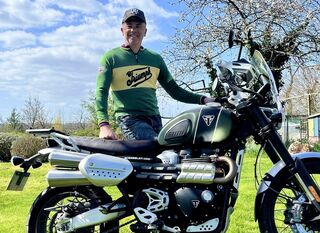 Thierry Nicolas with his Triumph jersey and (motor)bike